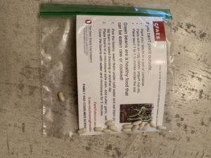 single plastic bag with postcard and seeds inside