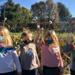 kids standing together in a garden