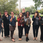 Teachers crunching apples on Apple Crunch day